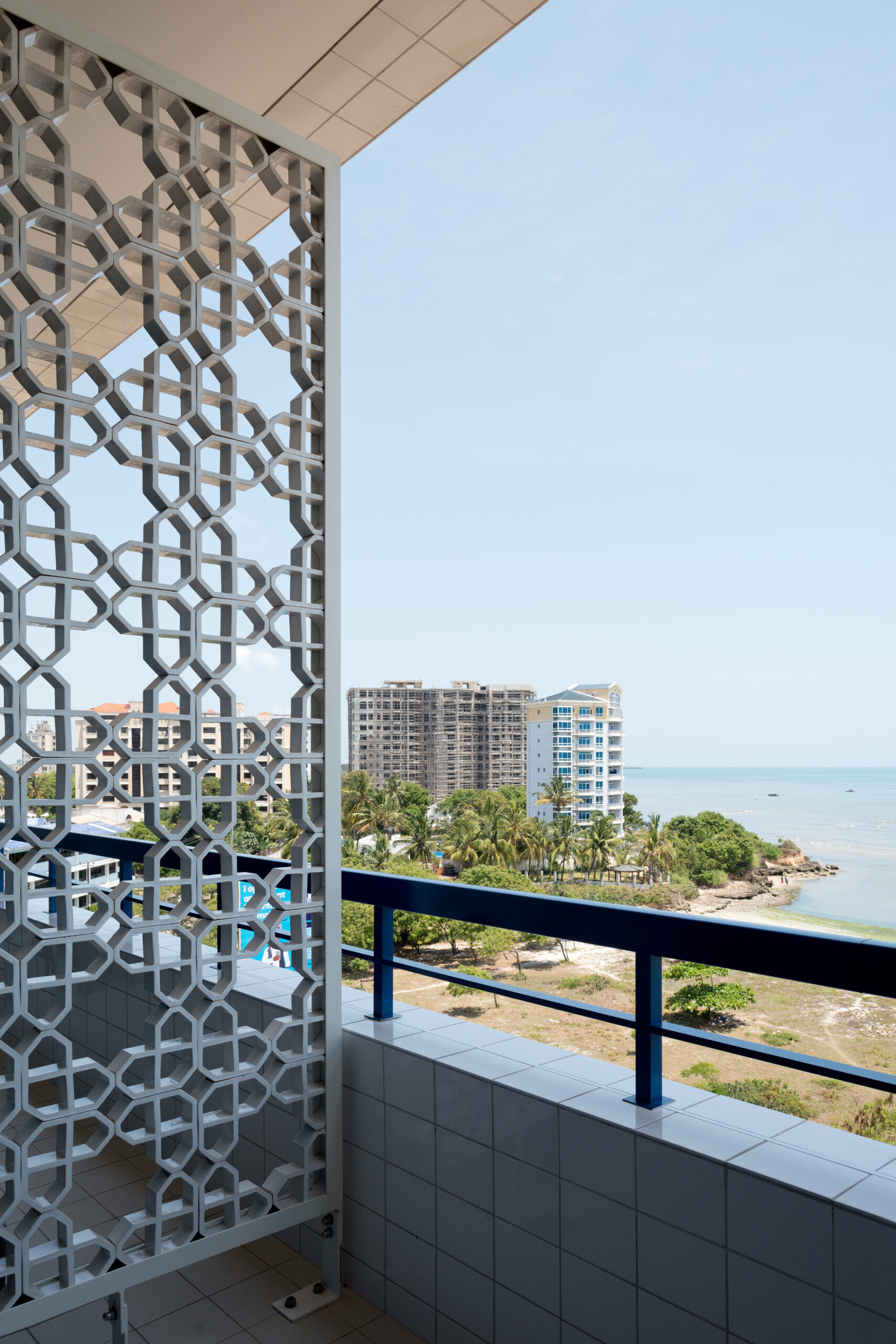 Ocean view from patient room with decorative divider screen on balcony