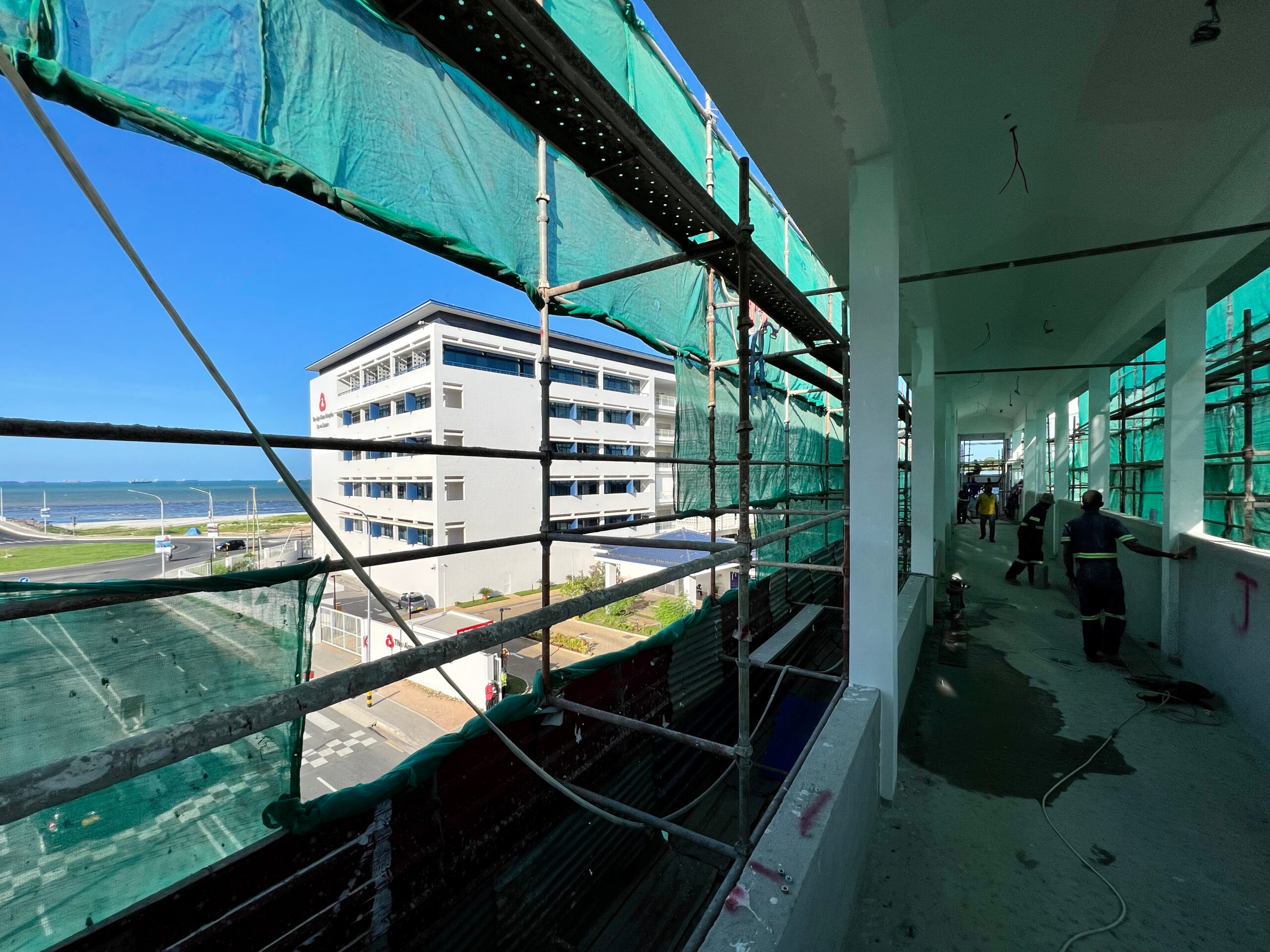 View of Phase 2 building and ocean beyond from upper deck of Ufukoni Skybridge