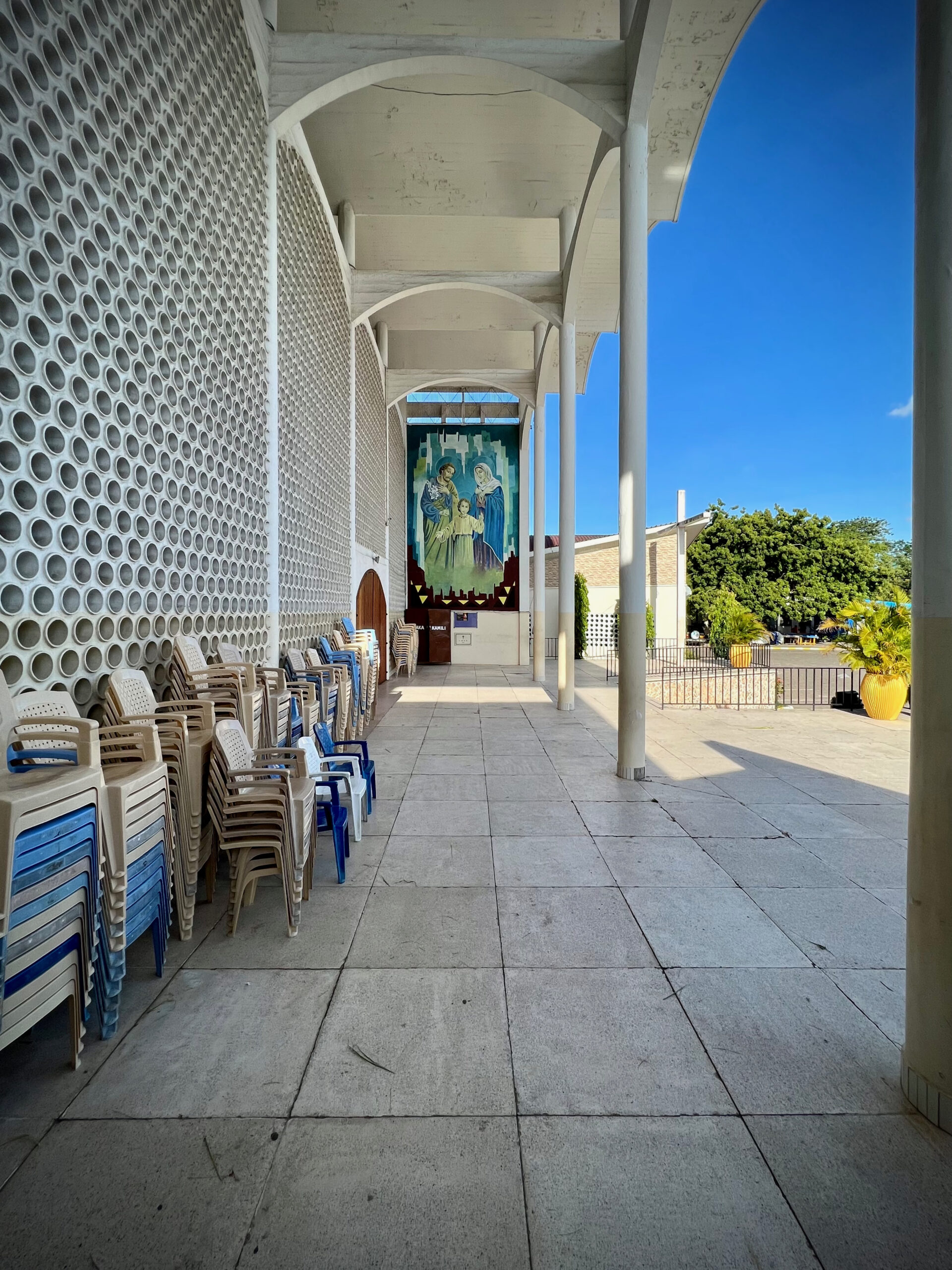 Veranda alongside the sanctuary with perforated facade